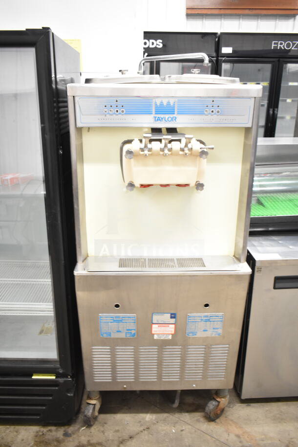 Taylor 754-33 commercial soft serve machine, floor style, water-cooled, 2 flavors with twist, on casters, 208-230V, 3 phase.