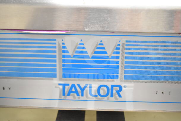 Taylor 754-33 commercial two-flavor soft serve ice cream machine, water-cooled, on casters, 208-230V, 3-phase.