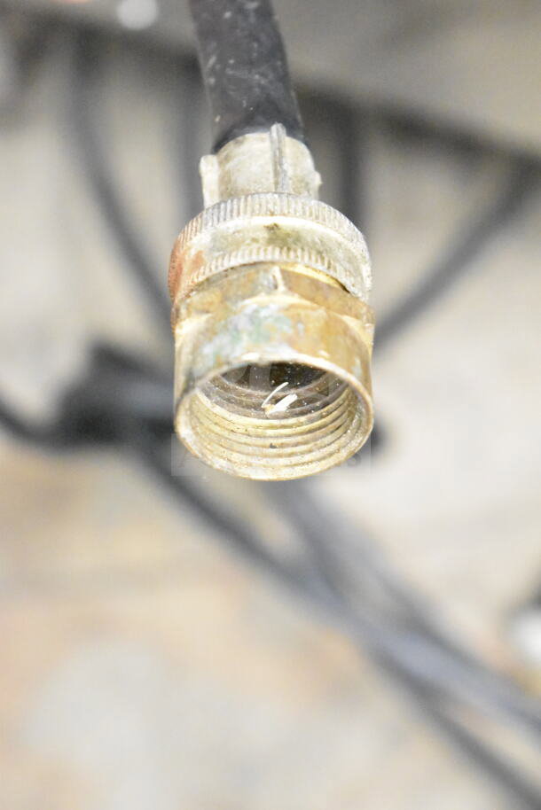 Close-up of a connector on a Taylor 754-33 commercial soft serve machine. Features water-cooled, 2 flavors with twist, on casters.