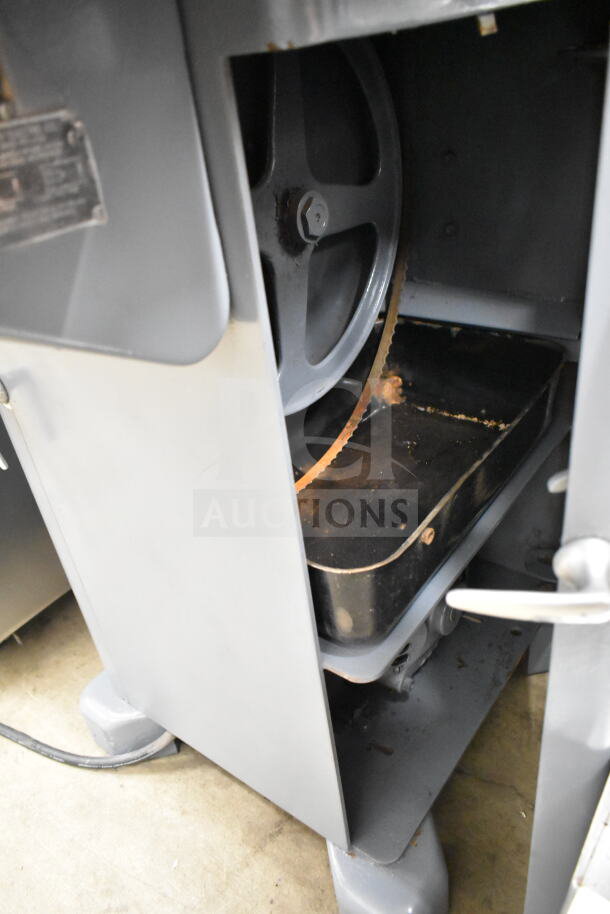 Biro 33 Commercial Floor Meat Saw, gray, metal, visible blade and wheel, some wear, suitable for heavy-duty cutting.