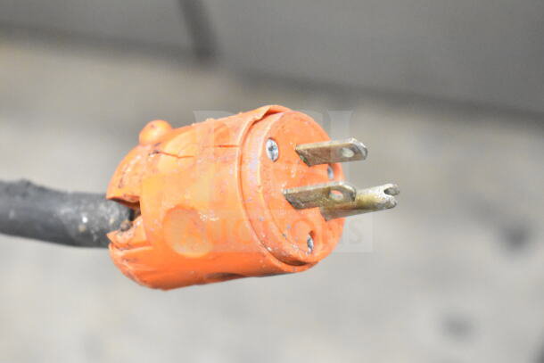 Close-up of the power plug for a Biro 33 commercial floor style meat saw, showing an orange, three-prong plug.