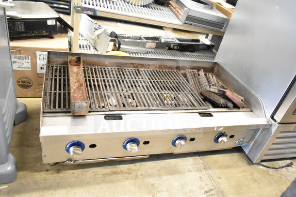 Globe Commercial Countertop Gas Charbroiler Grill, stainless steel, four controls, used condition, rust visible.