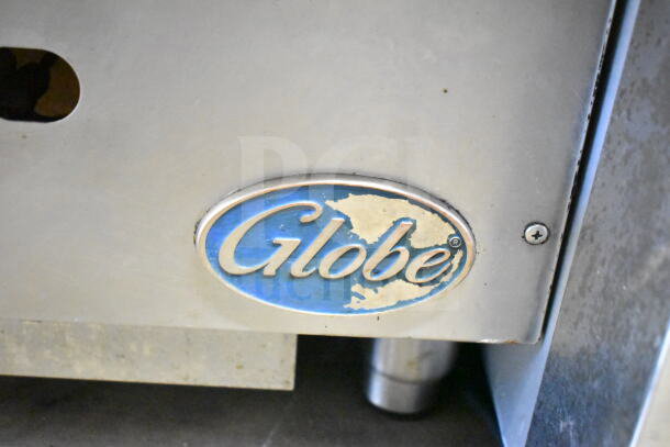 Globe Commercial Countertop Gas Charbroiler Grill logo close-up. Shows metal construction, indicating durability.