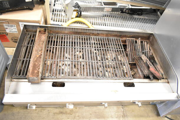 Globe Commercial Countertop Gas Charbroiler Grill with grates and burners visible; rustic condition, ideal for commercial use.