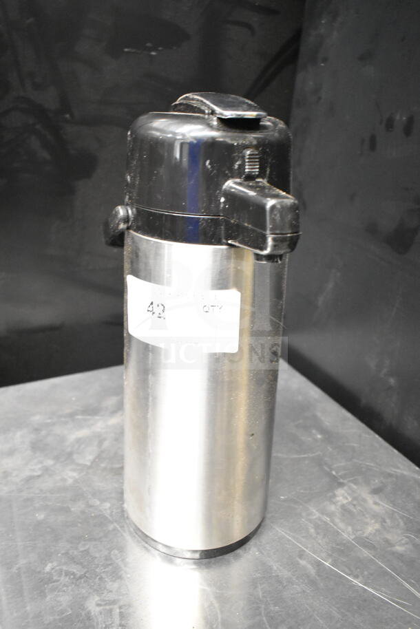 Stainless steel air pot with black lid, slight wear; label indicates quantity "42."