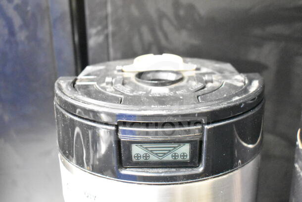 2 Luxus countertop coffee holder dispensers, black and stainless steel, digital display, used condition.