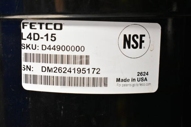 Fetco L4D-15 coffee holder dispenser, NSF certified, SKU D44900000, serial number DM2624195172, Made in USA label.