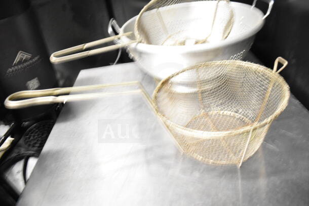 Set of 8 kitchen items including colander and mesh strainer, stainless steel, used condition, ideal for cooking.