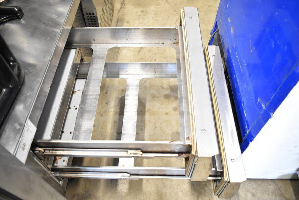 Continental Commercial 2 Drawer Chef Base on casters, 115V, 1 phase. Features stainless steel finish, visible wear.