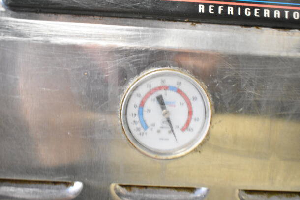 Continental commercial 2-drawer chef base on casters with temperature gauge. Operates at 115 volts, 1 phase. Visible wear.