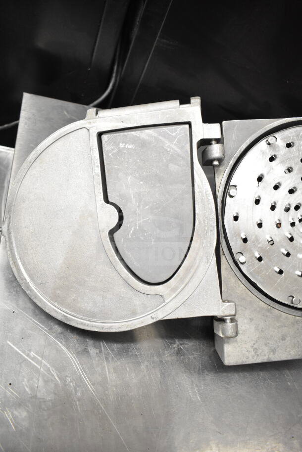 Pelican Head with Grating Blade, metallic finish, circular design, used condition, features perforated disc for efficient grating.