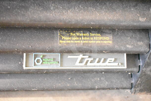 2019 True GDM-49-HC Cooler label showing warranty service info and natural refrigerant marking.