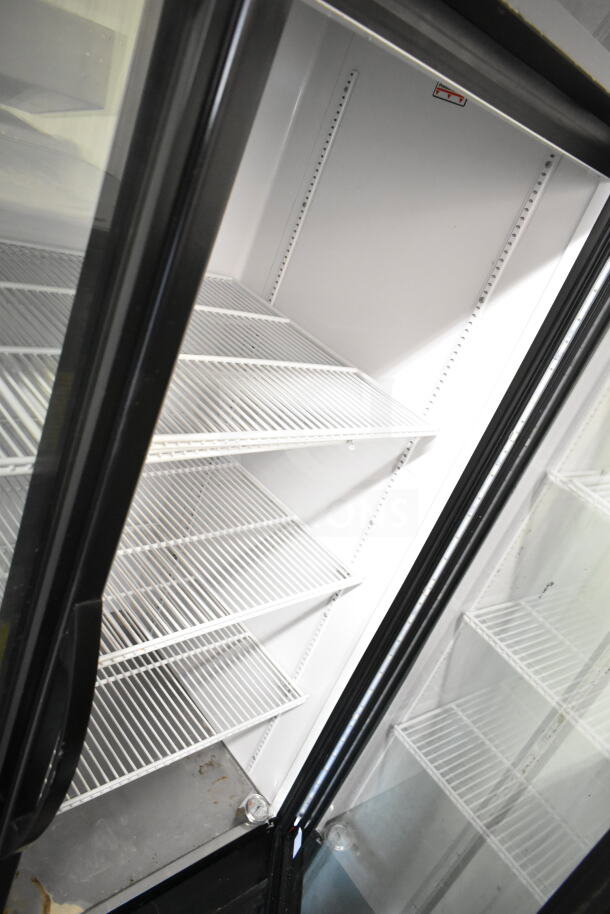 2019 True GDM-49-HC 2-door cooler merchandiser, glass doors, white shelves, used condition, 115V, 1 phase.