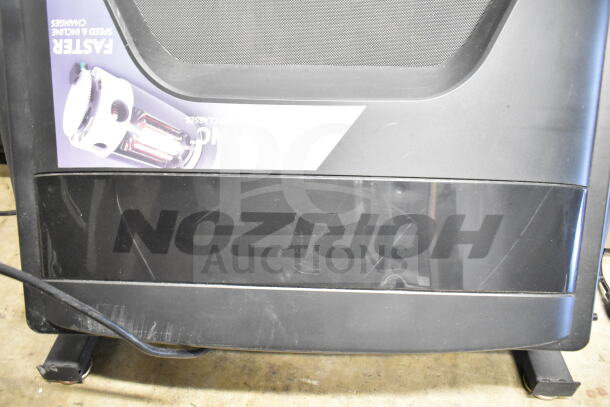 Horizon Folding Treadmill base with logo, features fast speed changes. Slight scuffs visible on the frame.
