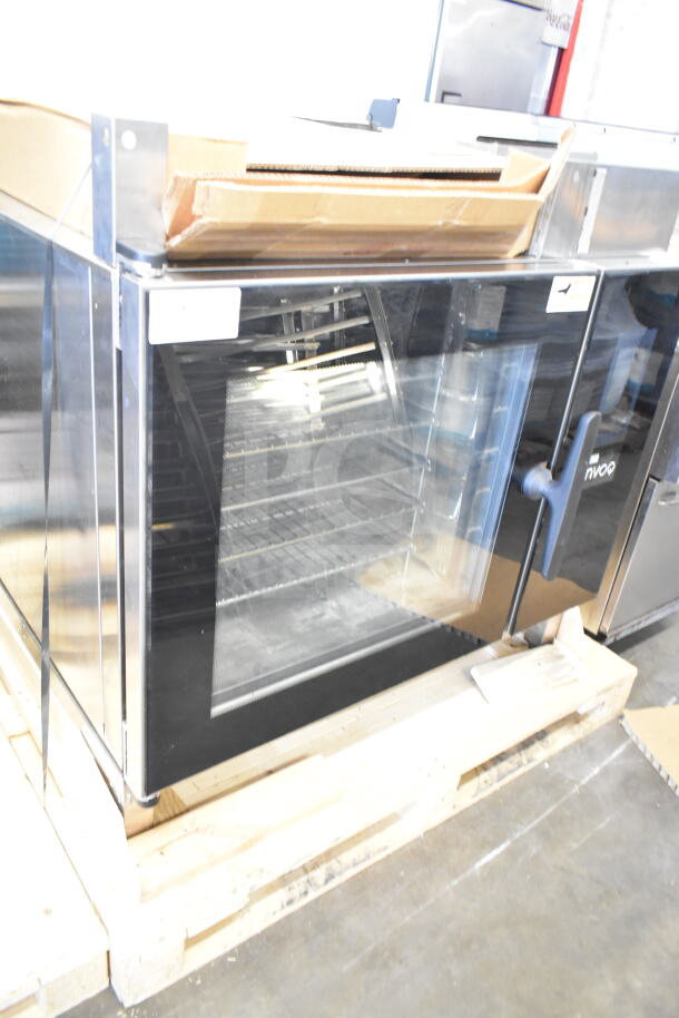 Brand new Blodgett Invoq commercial combi convection oven, scratch and dent condition, with glass door and interior racks.