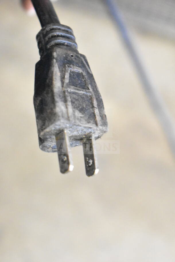 Close-up of a power plug for Marchia MDS250 Merchandiser, 115 volts. Shows wear, indicating used condition.