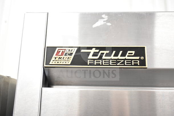 True T-49F Commercial 2 Door Reach In Freezer, stainless steel, visible label, 115V, 1 Phase, good condition.