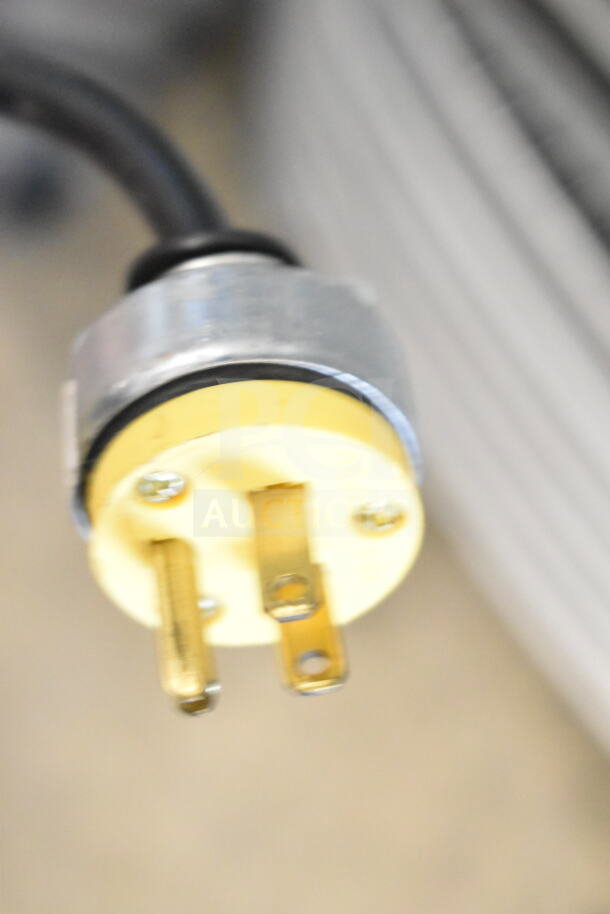Close-up of a power plug for a True T-49F commercial freezer, 115 volts, 1 phase.
