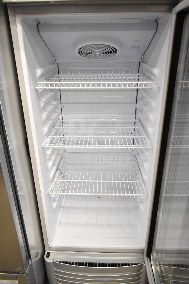 Premium Levella PRF90DX single door reach-in cooler, 115 volts, white interior, multiple wire shelves, excellent condition.