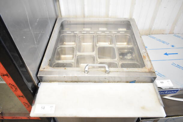 Turbo Air MST-28-12 Refrigerated Sandwich Prep Table, 28" wide, with stainless steel pans and a cutting board, showing wear.