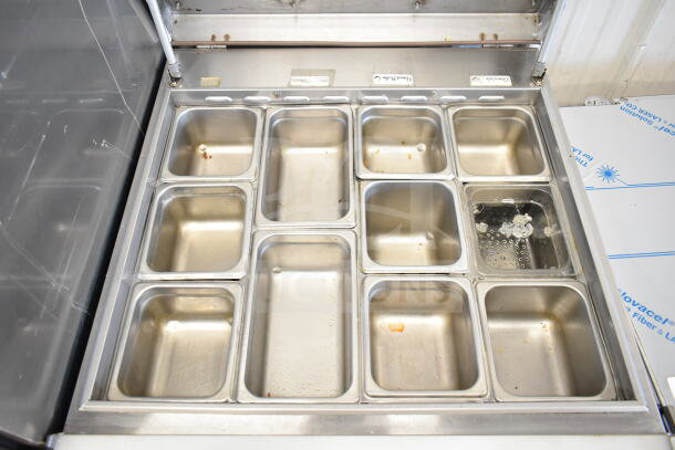 Turbo Air MST-28-12 sandwich prep table with stainless steel pans, commercial M3 series, 28", one door, 115V.