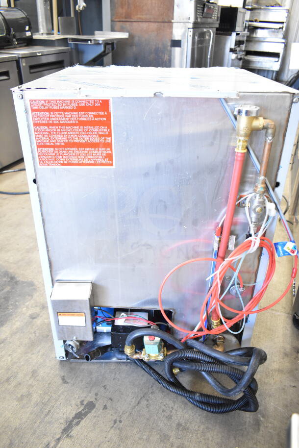 2022 Jackson DISHSTAR HT-E undercounter dishwasher, 208/230V, 1 phase. Features visible caution labels, hoses, and electrical connections.