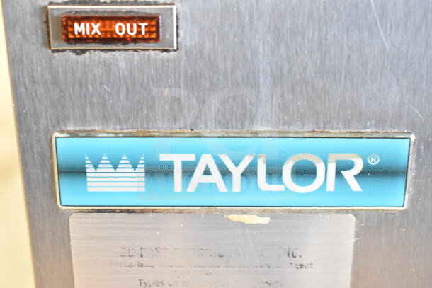 Taylor 383-27 commercial frozen beverage machine, stainless steel, "Mix Out" indicator, 208-230V, 1 phase.
