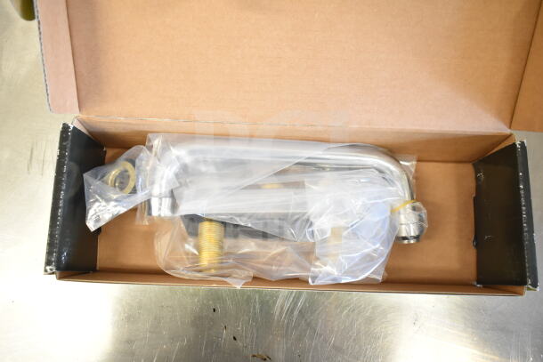 Brand new Regency 600FD48 deck-mounted faucet with 4" centers and 8" swing spout in original packaging.