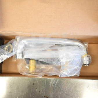 Brand new Regency 600FD48 deck-mounted faucet with 4" centers and 8" swing spout in original packaging.