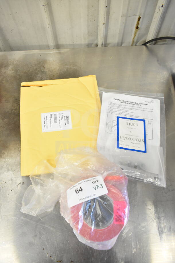 Three brand new items: Stacking clip kit, grater blade, bag sealer tape. All in original packaging, labeled for auction.