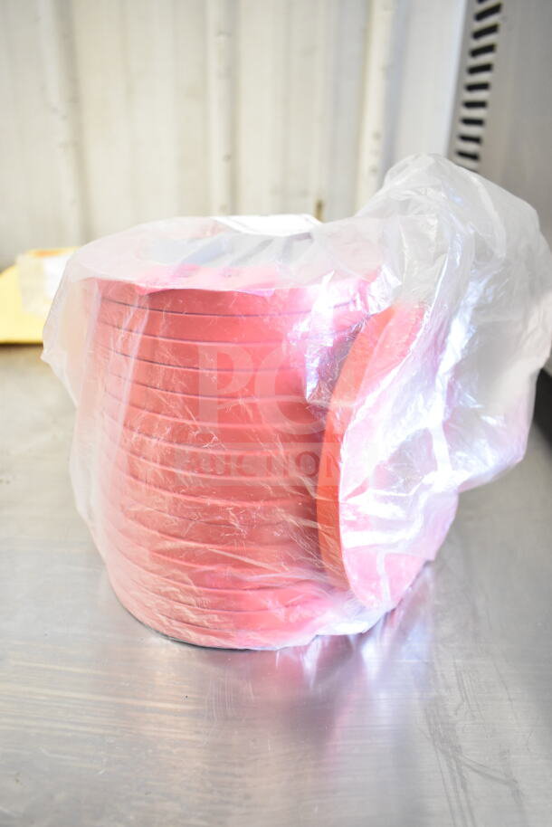 Red bag sealer tape roll in plastic wrap, new condition, on metallic surface. Auction item includes stacking clip kit, grater blade.