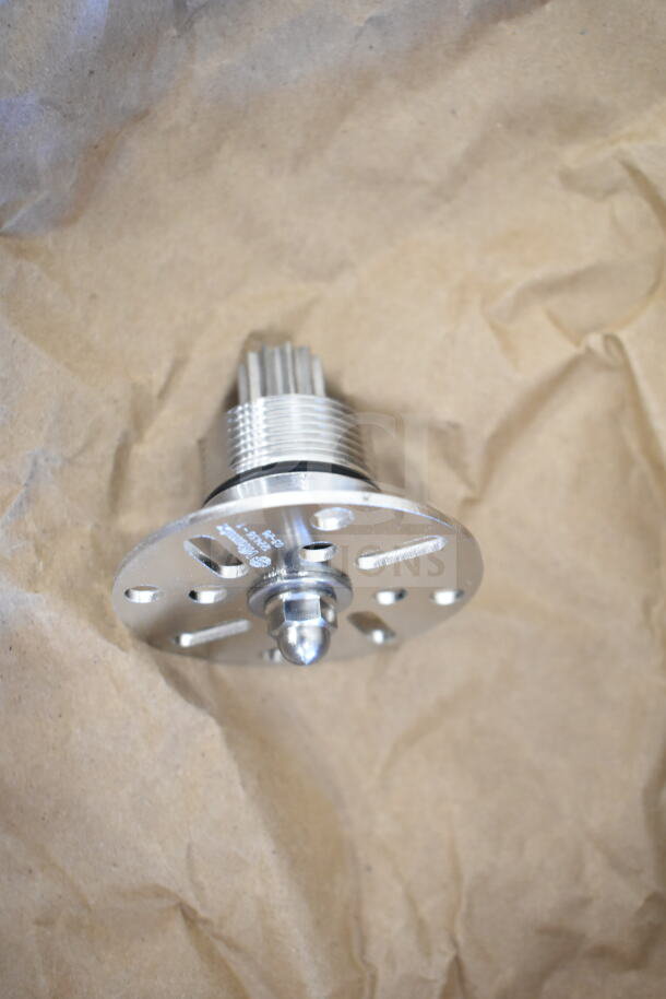 New Vitamix blade component. Metal construction, circular base with central bolt. Appears in flawless condition.