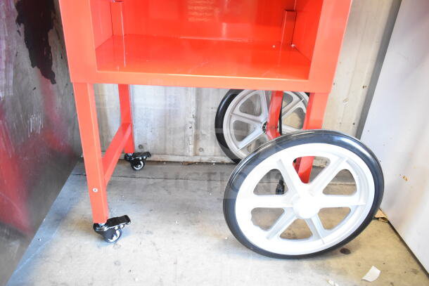 Carnival King 382PM30R Royalty Series red popcorn machine stand, featuring large white wheels and caster legs.
