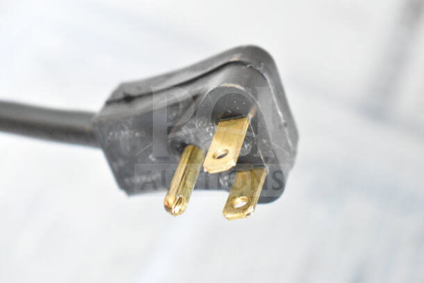 Close-up view of a power plug for the 2019 Habco SE18 Commercial Cooler, 115V, 1 Phase, showing prongs and black casing.