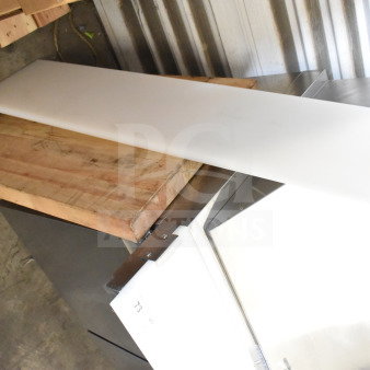Two cutting boards, one wooden and one plastic, in used condition. Auction lot label visible.