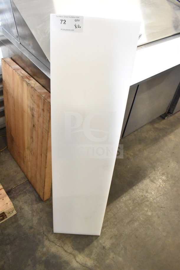 Two cutting boards; one large white plastic, one rectangular wood. Offer includes two units per bid. Label notes quantity.