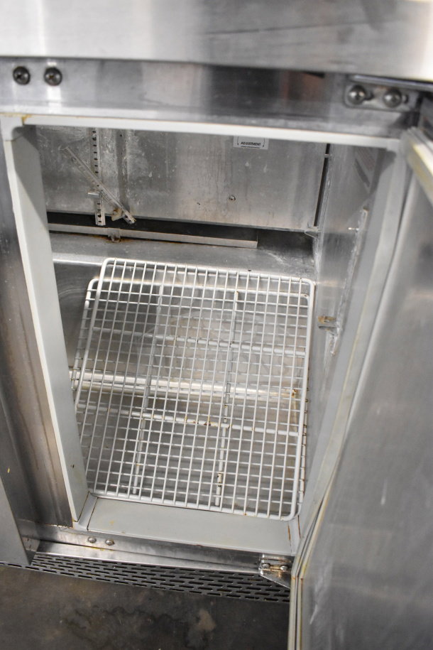 Continental SW36-10 sandwich salad prep table, visible interior, metal grid shelf, stainless steel finish, commercial use.
