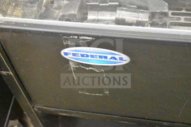 Federal Commercial Horizontal Grab N Go Merchandiser, black, visible wear, Federal logo, ideal for retail display.