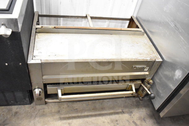 Jade gas-powered commercial cheese melter in used condition, metal finish, with visible control knob and Jade branding.