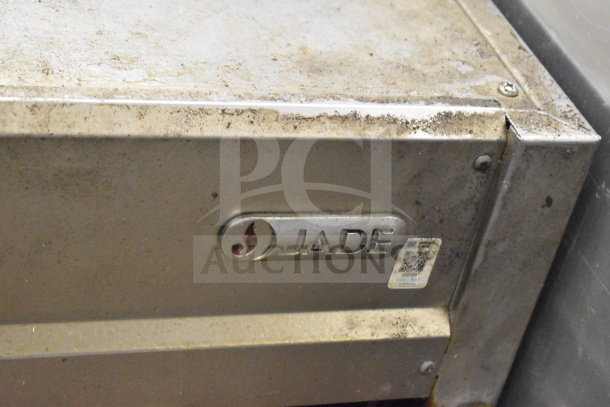 Jade Gas Powered Commercial Cheese Melter, worn stainless steel exterior with visible Jade branding and QR code label.
