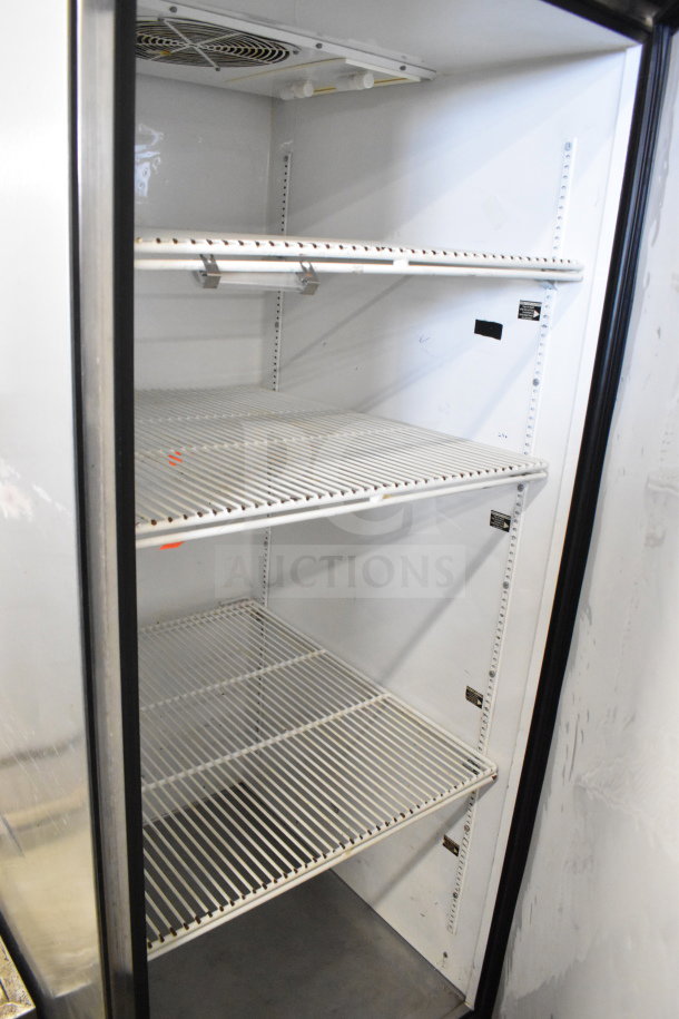 True TG1R-1S commercial single door reach-in cooler with adjustable wire shelves, on casters. 115 volts, 1 phase.