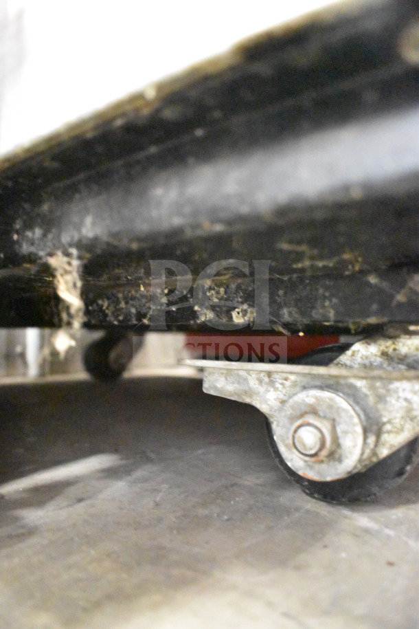 True TG1R-1S commercial reach-in cooler on casters, visible undercarriage detail. Electric, 115 volts, 1 phase.