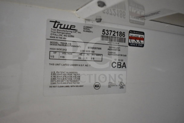 True TG1R-1S commercial cooler label, 115 volts, single phase. Model and serial numbers visible, made in USA.