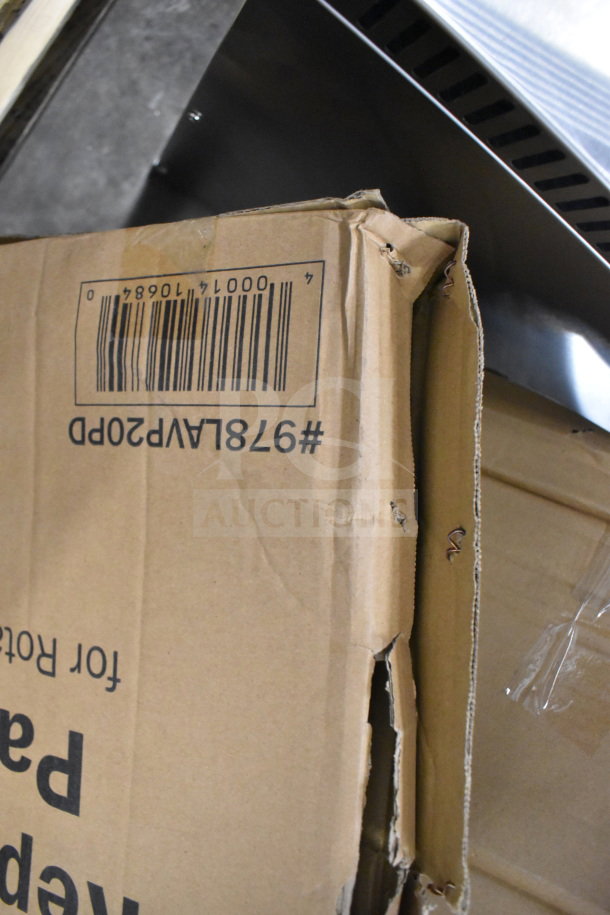 Brand new Lavex 978LAVP20A floor cleaning machine box with dent, model number and barcode visible.