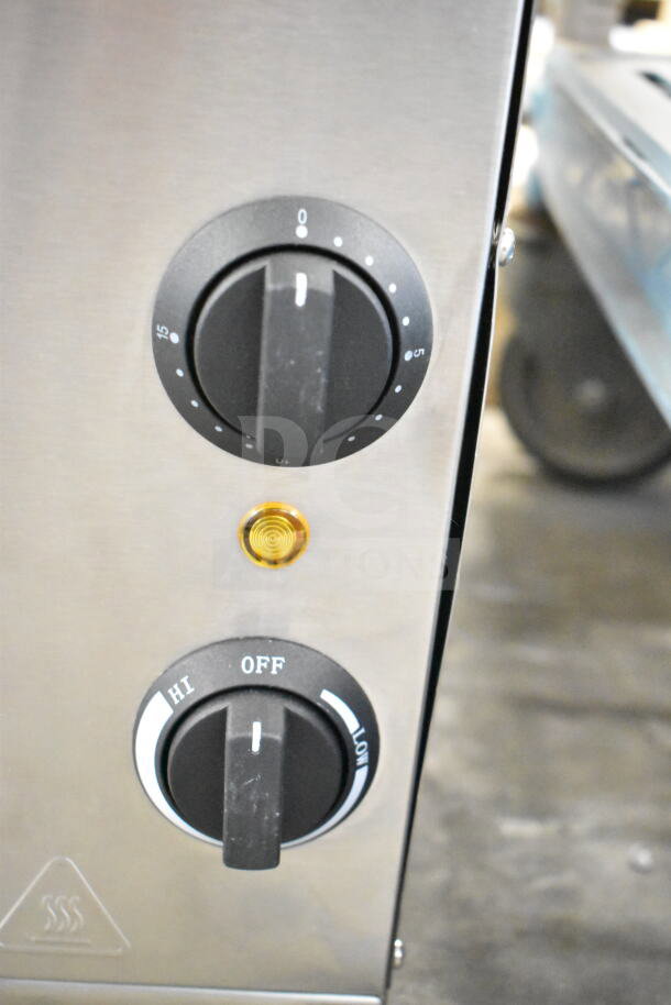 Brand new Avantco 177CHSME32IM 32" electric cheese melter with dials, slight scratch and dent, 208/240 volts.