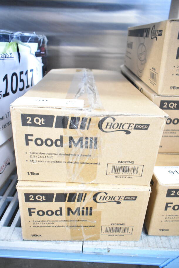 Two new Choice 407FM2 stainless steel rotary food mills, 2 qt. capacity, with three sieves, in original packaging.