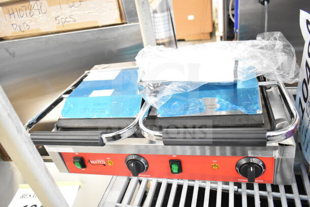 Brand new Avantco 177PG400S dual panini grill, smooth plates, 19 5/8" x 9 1/8" cooking surface, 120V, minor scratches.