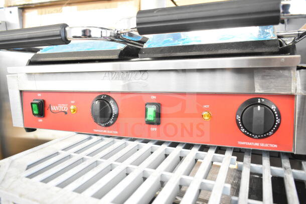 Brand new 2023 Avantco 177PG400S commercial dual panini grill with smooth plates, temperature dials, and power switches.
