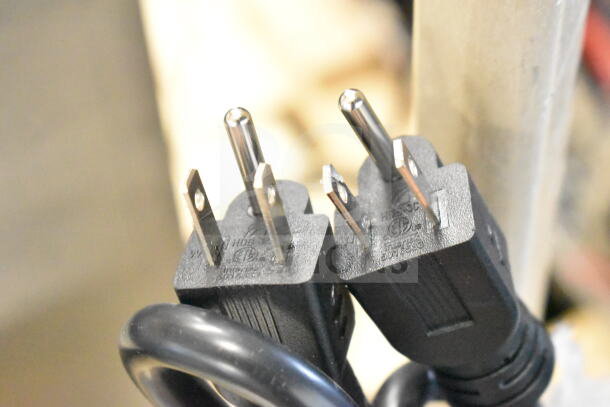 Close-up of power plugs for Avantco 177PG400S Panini Grill, showing detailed plug design and markings.