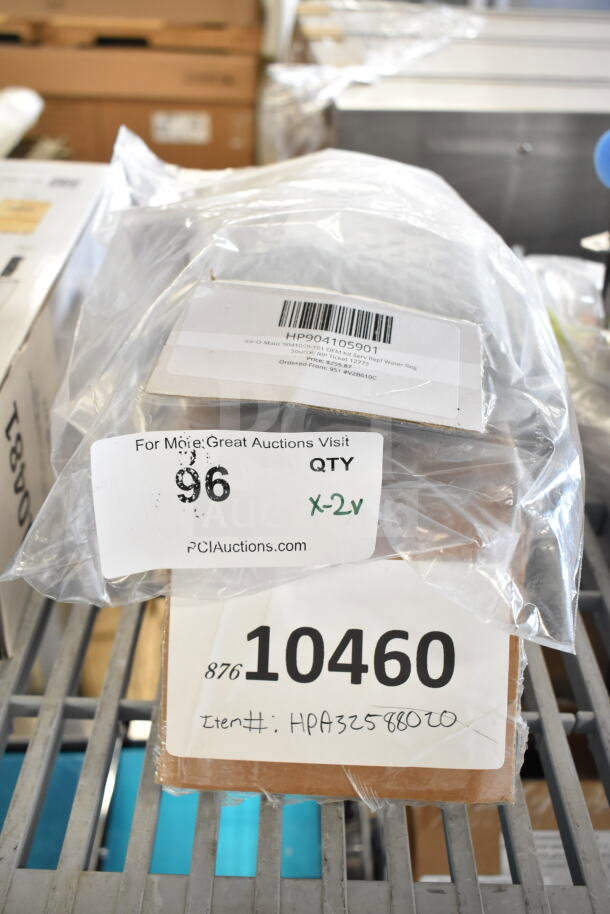2 new scratch and dent items, Ice-O-Matic OEM Kit and Scotsman Pump. Tags show part numbers and bid quantity.